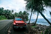 red jeep parked along the puna coastline in Hawaiʻi